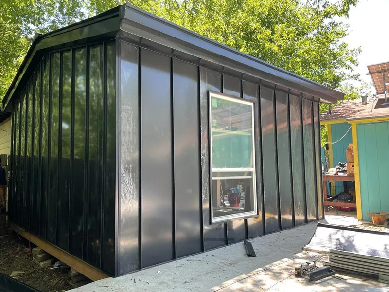 Black standing seam metal wall panels for Roof Inspection in Trinidad